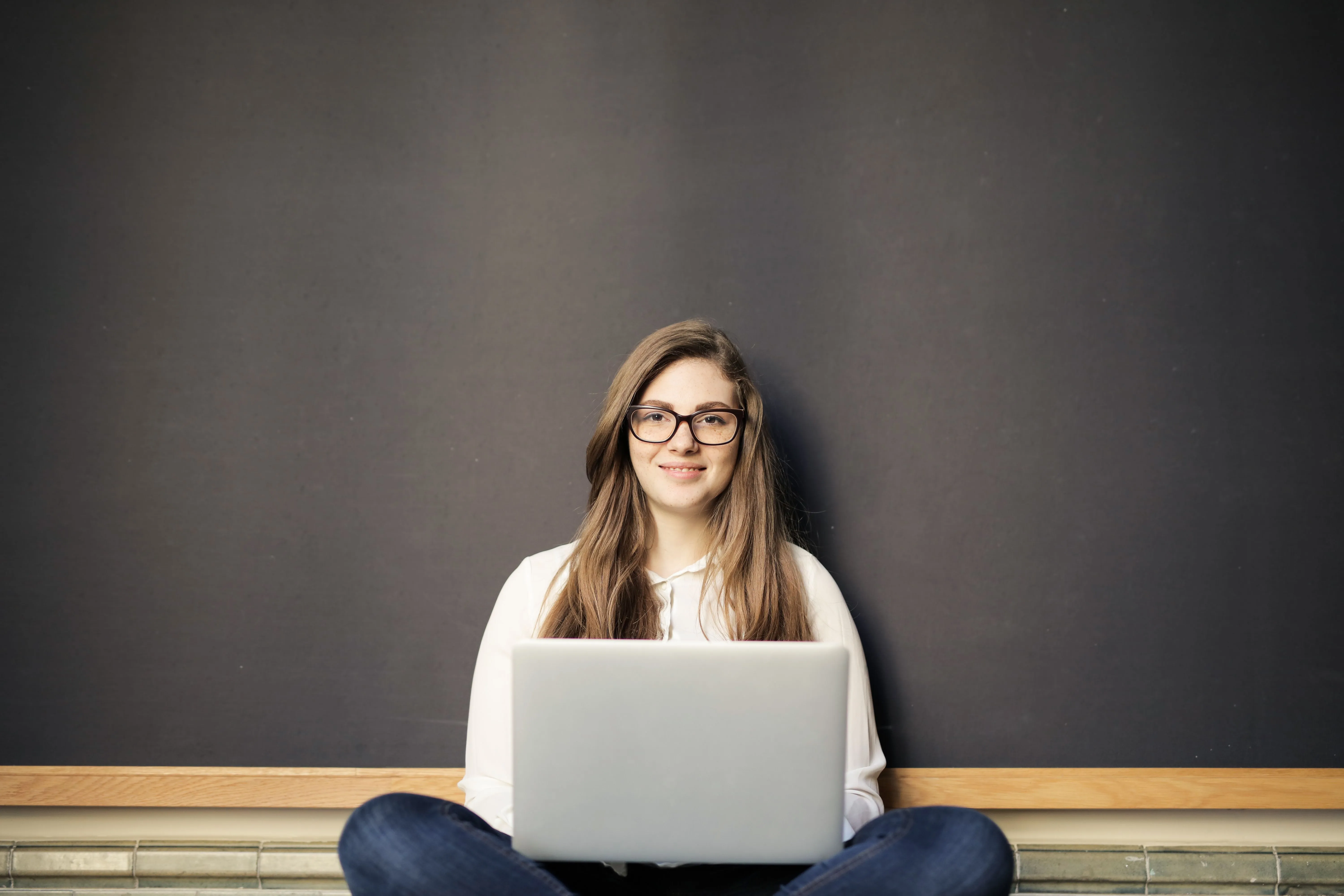 A remote software developer working on a laptop